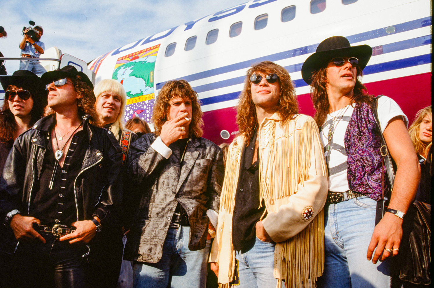 Musicians arriving at the airport for the Moscow Music Peace Festival 1989 at Luzhiniki Stadium, Moscow, Russia, 9th August 1989. (L-R) Tom Keiger (vocals and guitar) (Cinderella), Klaus Meine (vocals) (Scorpions), Alexei Belov (guitar) (Gorky Park), Ozzy Osbourne (vocals), Jon Bon Jovi (vocals) (Bon Jovi), Richie Sambora (guitar) (Bon Jovi). - Koh Hasebe/Shinko Music / Getty Images