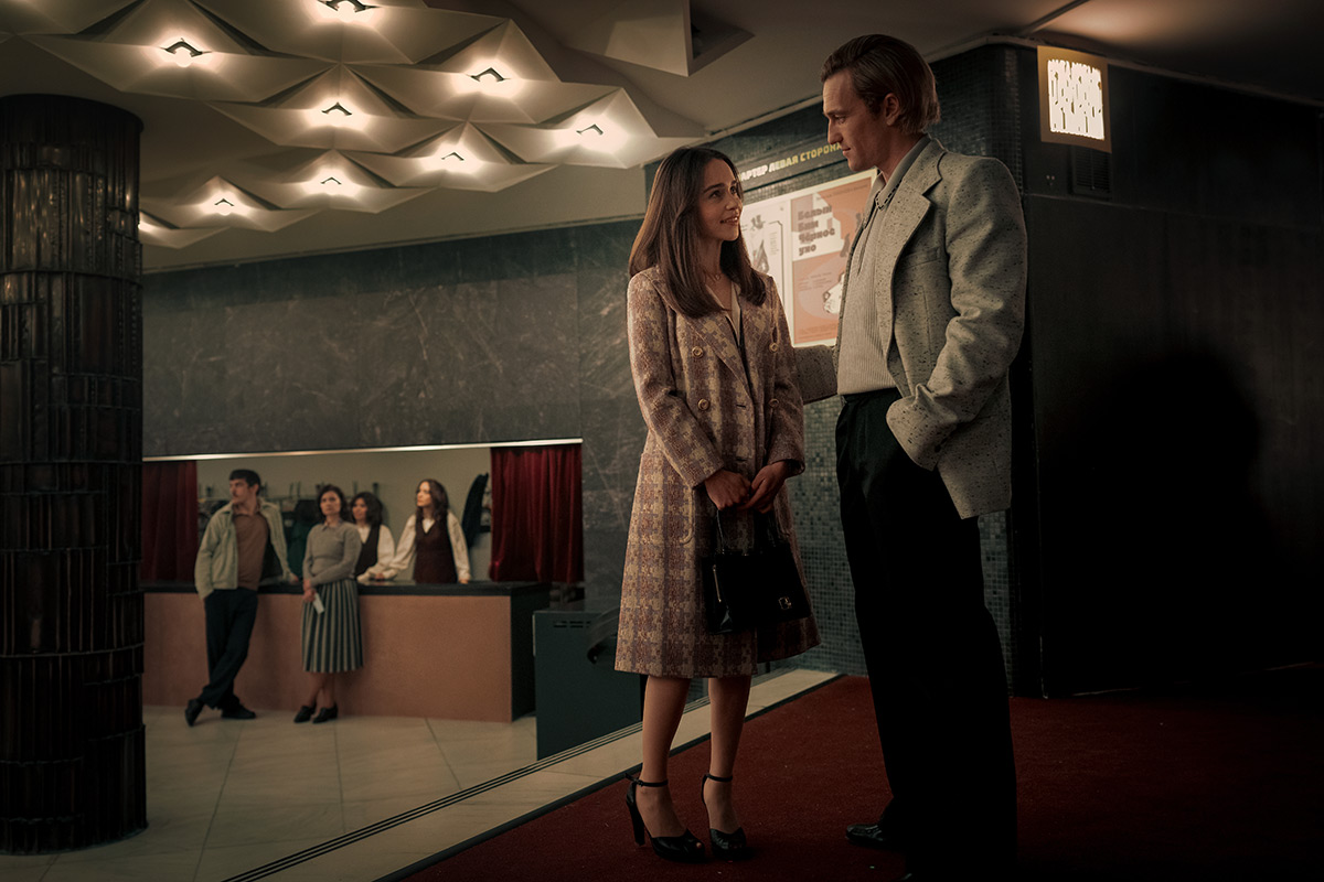 Pictured: (l-r) Emilia Clarke as Bea, Artjom Gilz as Andrei -- - - David Lukacs/PEACOCK